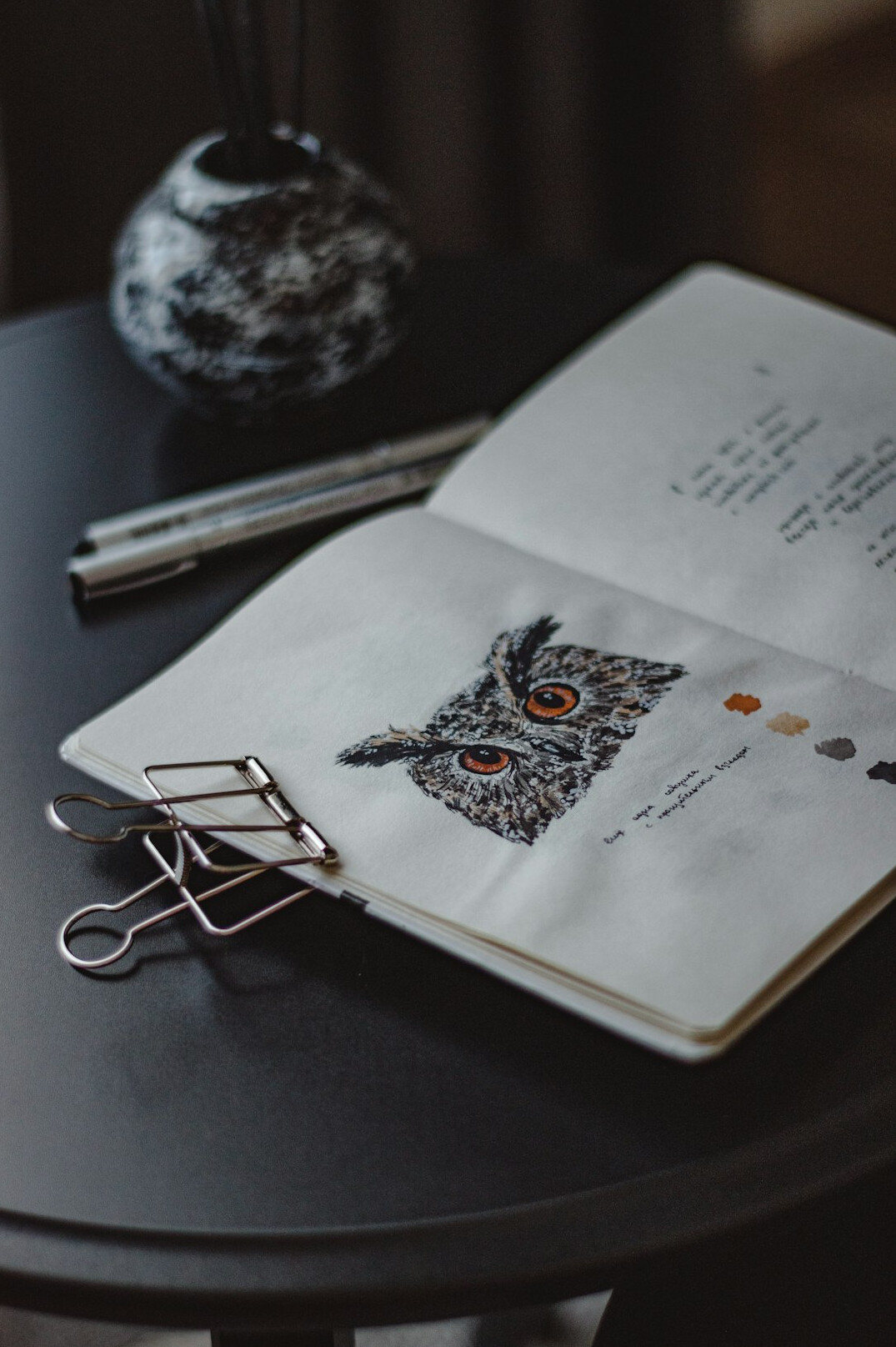 Open notebook and pen on a table