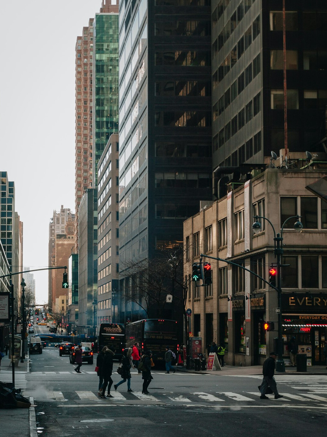 Busy city street with buildings and passersby